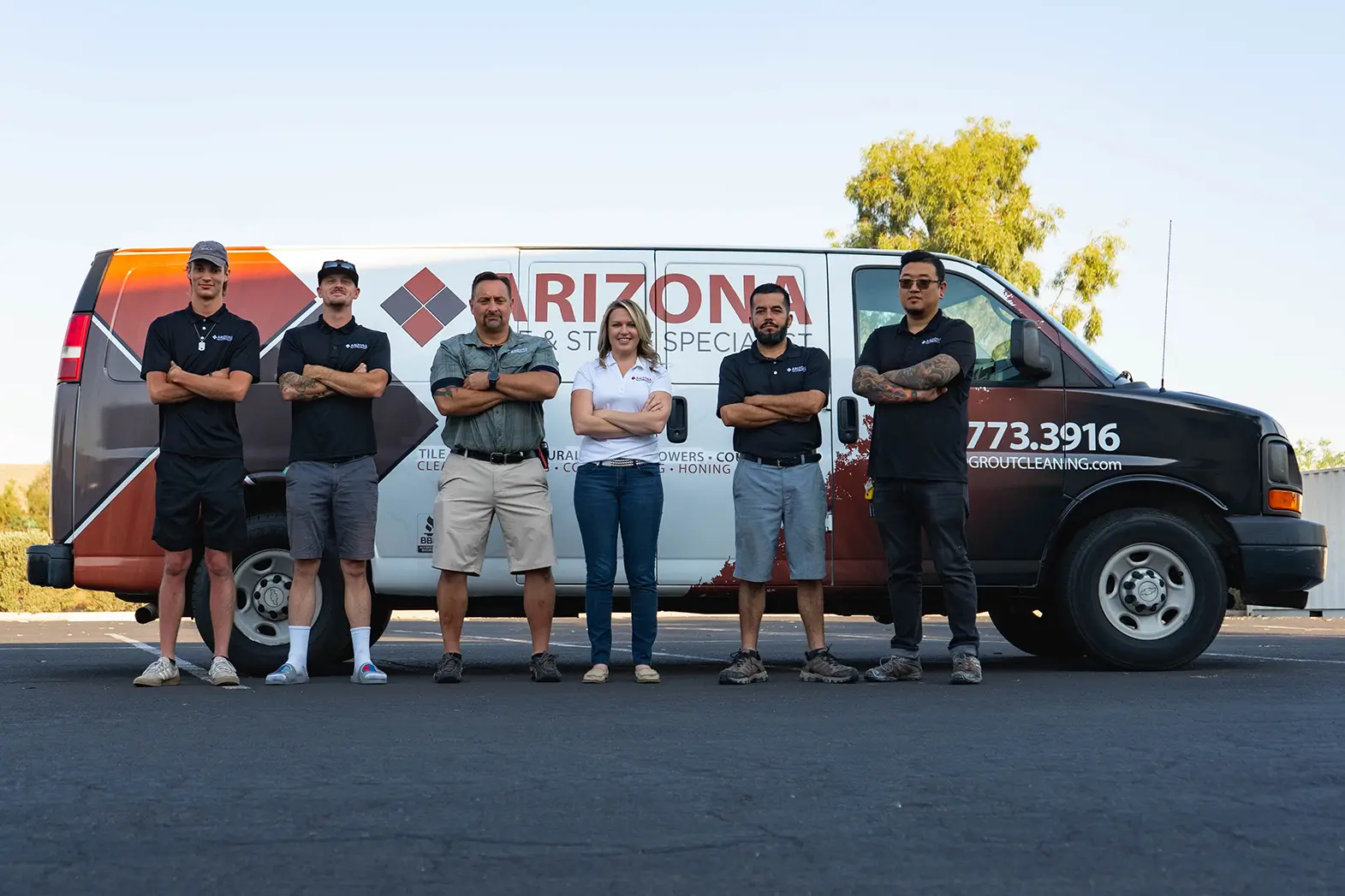 The cleaning team standing in front of their service truck, ready to help homeowners.
